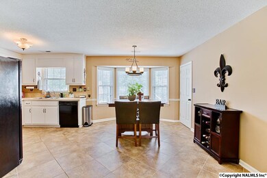 Dining Area is open to both the Kitchen and the Family Room.