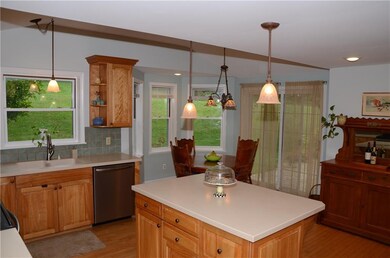 Sliding glass doors lead to patio & back yard.