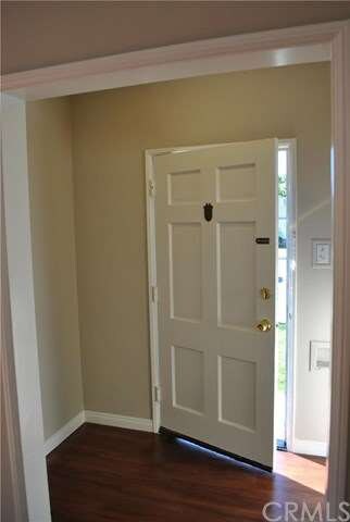 A small entry with room for a table, door with spe