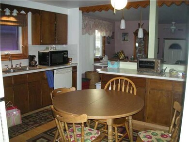 Kitchen hardwood floor--loads of cabinets dishwash