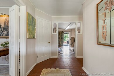 SPACIOUS TILED ENTRY WITH TWO COAT CLOSETS