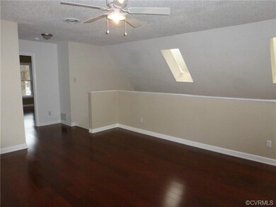 Loft with Ceiling Fan and Gorgeous Laminate Floori