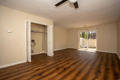 Unfurnished bedroom with access to exterior, baseb