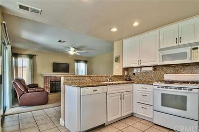 Partial views of the kitchen and the family room. 