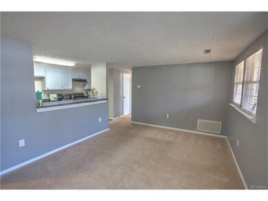 Spacious family room with newer carpet. What an in
