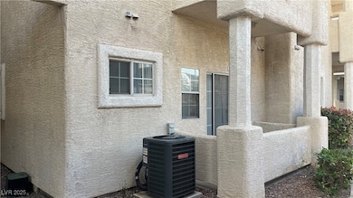 Details featuring stucco siding and cooling unit