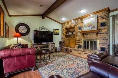 living room, huge beam,wood burning fireplace with