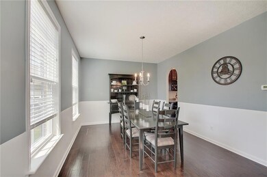 The formal dining room is at the front of the home, with abundant natural lighting and hardwood floors that extend the whole main floor.