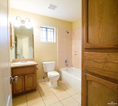 Full bathroom featuring vanity,  shower combination, and tile patterned flooring