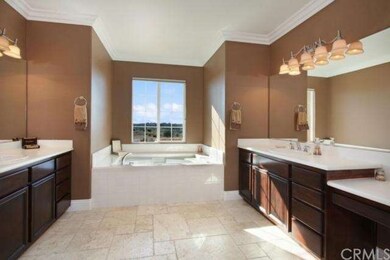 Master bath with dual vanities, and separate tub a