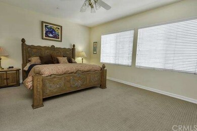 Large master suite with lush carpet and views of b