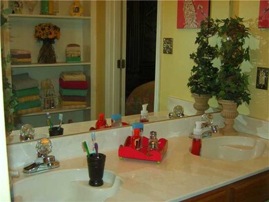 Master Bath has double vanity with shelving and wa