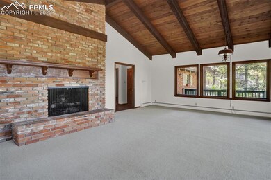 Great Room with beamed and vaulted ceilings.  Wood