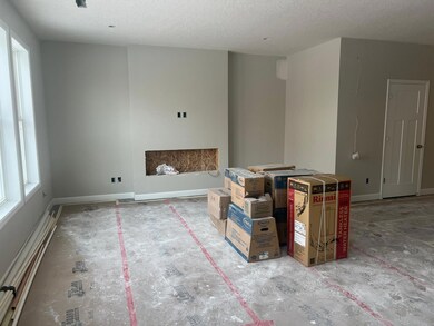 The spacious family room seamlessly connects to the kitchen, perfect for entertaining. It also features many large windows providing warm natural light! Here is the home as of 1/16!