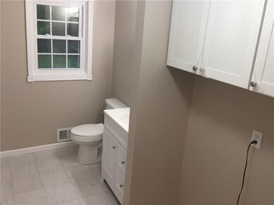Laundry and  tiled full bath