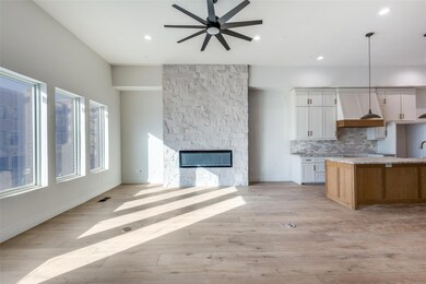 Kitchen and living featuring 12 foot ceilings, sto