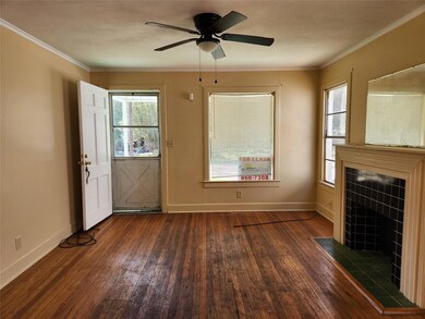 Unfurnished living room featuring ceiling fan, a t