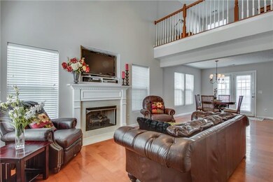 Living room is open to dining area and kitchen.  E
