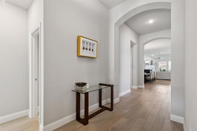 Corridor with light wood-type flooring