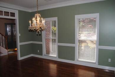 The formal dining room offers hardwood floors and 