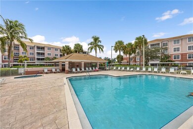 Community pool featuring a patio, a gazebo, and fe