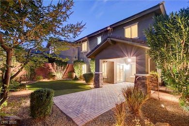 View of front facade featuring stucco siding and a patio