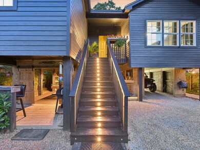 The lighted stairs lead you to the front door of y