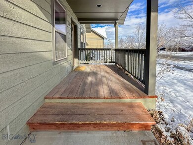 Snow covered deck with a porch