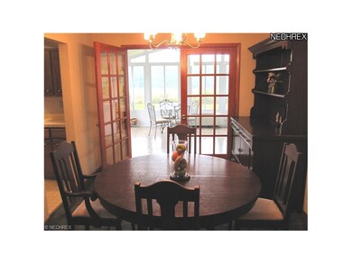 Formal Dining Room with Carpet Over Hardwood Floor