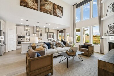 Large Family Room with soaring ceilings and beautiful windows.