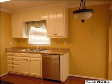 ADORABLE EAT-IN KITCHEN WITH VIEW OF THE BACKYARD. NEW STAINLESS STEEL APPLIANCES, HARDWOOD FLOORS, CROWN MOULDING, FRESH PAINT AND NEW LIGHTENING.