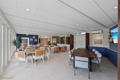 Dining room with a paneled ceiling, recessed lighting, an AC wall unit, and a wall unit AC