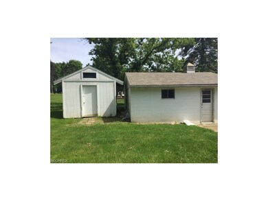 Shed located at rear of garage.