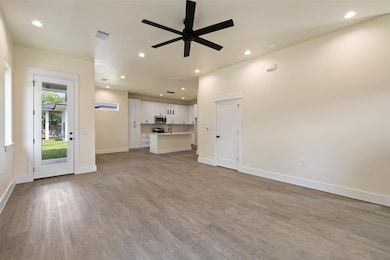 Unfurnished living room featuring recessed lighti