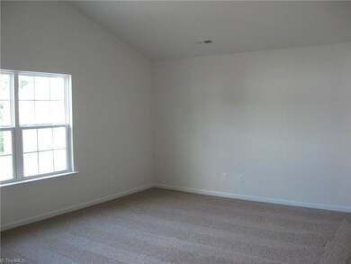 Vaulted master bedroom with plush carpeting! Home under construction is similar to one in photo.