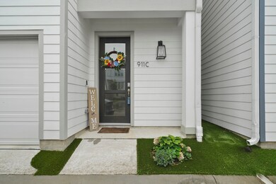 The covered front porch offers a welcoming entranc