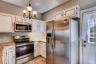 Modern kitchen with stainless steel appliances. Re