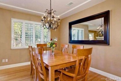 The formal dining room opens to the living room an