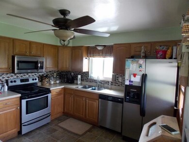 Updated kitchen with mosaic backsplash.