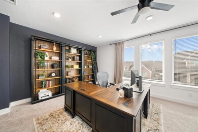 Carpeted office space with ceiling fan