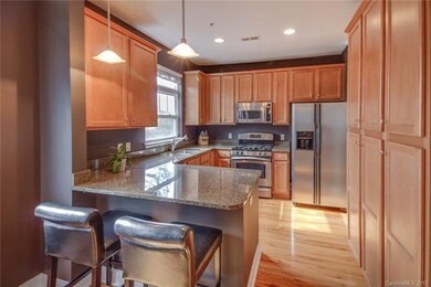 View of kitchen from dining area, lots of storage,