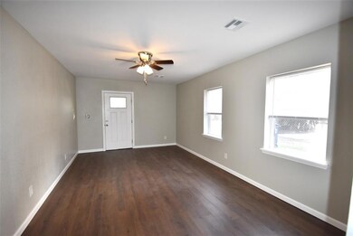 Large living room with lots of natural light featu