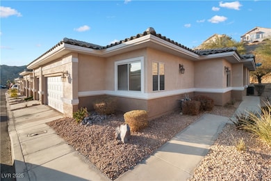 View of side of home with a tiled roof, concrete d