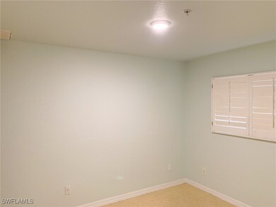 Unfurnished room with fire sprinkler in ceiling an