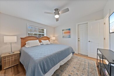 Bedroom with wood finished floors and ceiling fan