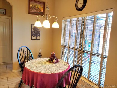 Breakfast nook with view of back yard and pond.