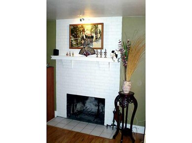Living Room. Beautiful log-burning fireplace in li