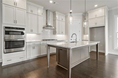 Kitchen includes 42 inch soft close cabinets with under cabinet lighting.*Picture is not of actual home but same Caplin floorplan*