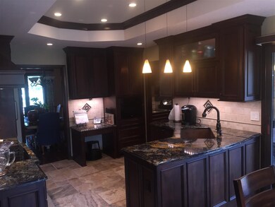 Gorgeous walnut cabinetry and granite countertops,