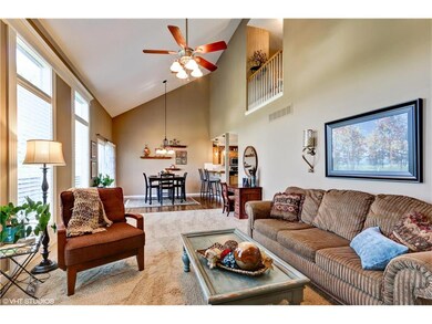 Spacious living room opens to breakfast eating are